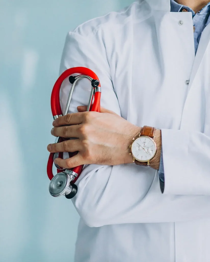 Young physician in a medical robe with stethoscope